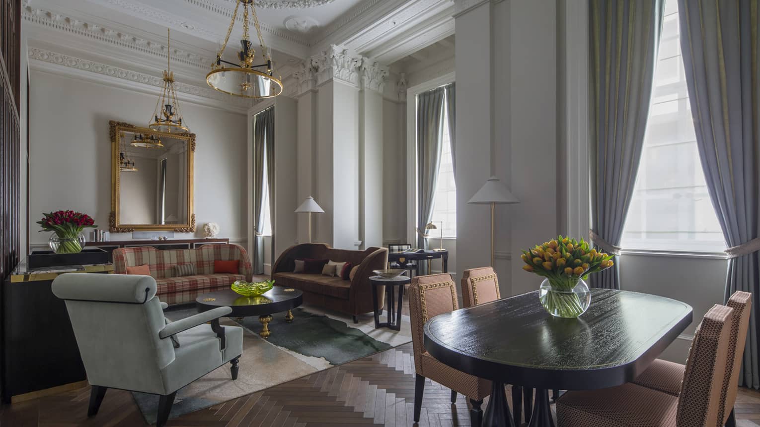 Heritage Suite dining table, seating area by tall, sunny windows 