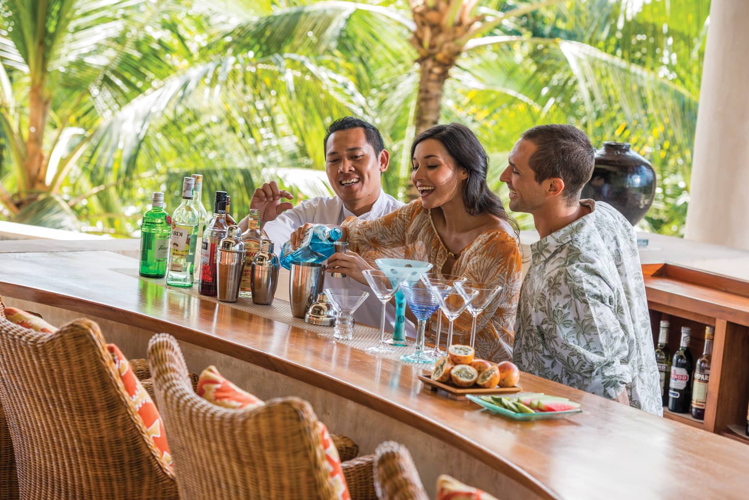 Guests learning how to mix drinks at a cocktail class in Bali